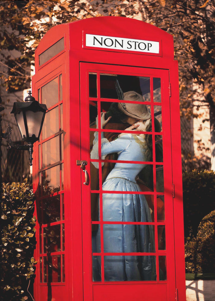 A couple in vintage clothing share a passionate kiss inside a classic bright red telephone booth. The woman is wearing a light blue dress, and the man wears a hat. The sign above the booth door reads 'NON STOP'. The setting appears to be outdoors in autumn. Wall Art