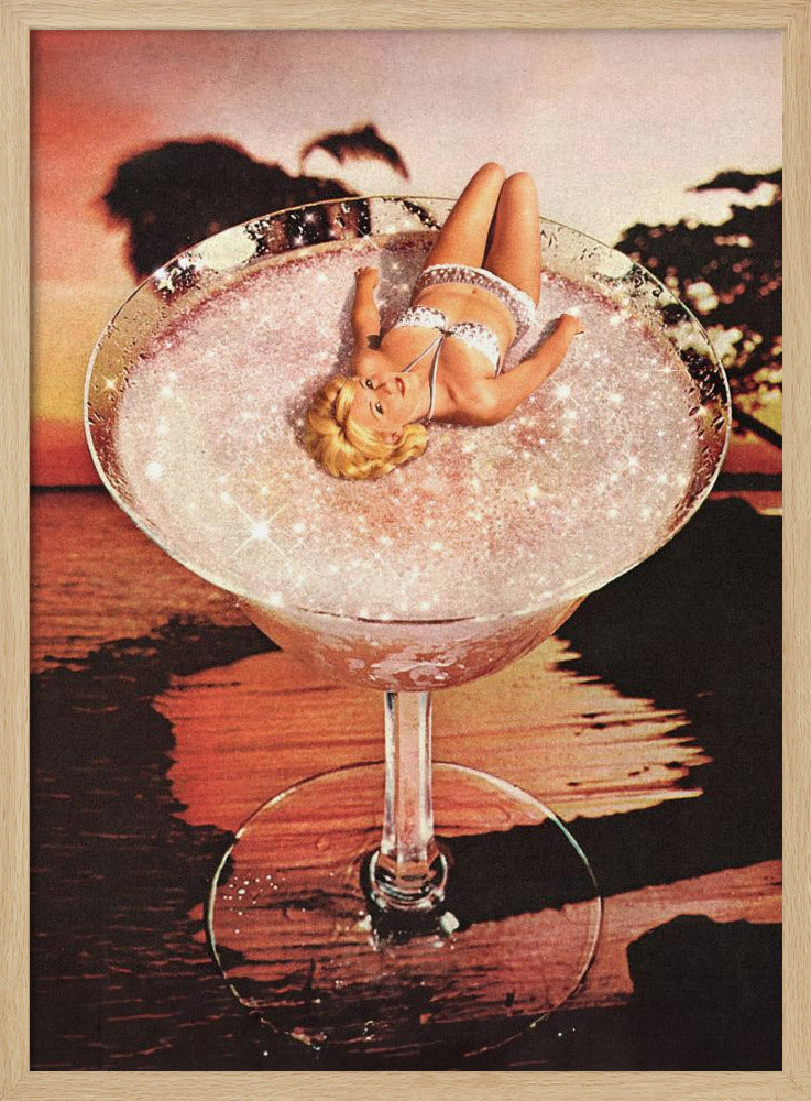A surreal collage featuring a blonde woman in a white bikini lounging in a giant cocktail glass filled with a sparkling pink liquid, set against a warm sunset over the ocean. Print