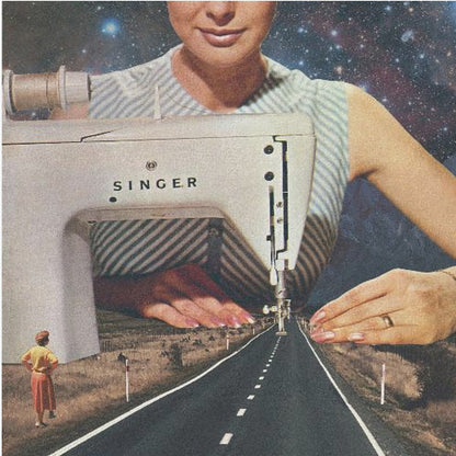 A surreal collage in a light wood frame featuring a giant woman in a striped dress using a vintage Singer sewing machine to stitch the white dashed lines onto an empty road that stretches into the distance. The background behind the woman is a starry galaxy, and a small woman in vintage clothing stands on the side of the road looking on. Print