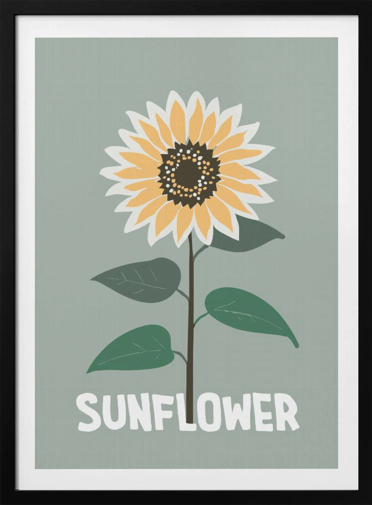 A stylized illustration of a single sunflower against a muted sage green background. The flower has yellow and white petals, a dark brown center, and a thin brown stem with green leaves. At the bottom, the word 'SUNFLOWER' is written in a bold, white, sans-serif font. The artwork is presented within a simple black frame. Decor