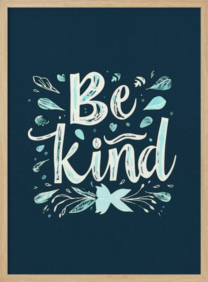 An inspirational art print with a dark blue background featuring the phrase 'Be Kind' in a stylized, hand-lettered white and light blue font. The text is decorated with small leaves, hearts, and flourishes in shades of teal and white. Artwork