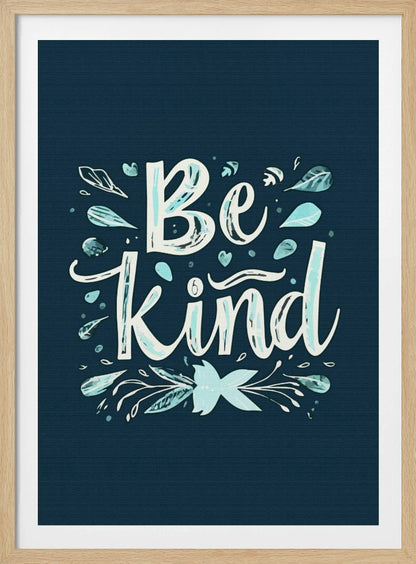 An inspirational art print with a dark blue background featuring the phrase 'Be Kind' in a stylized, hand-lettered white and light blue font. The text is decorated with small leaves, hearts, and flourishes in shades of teal and white. Artwork