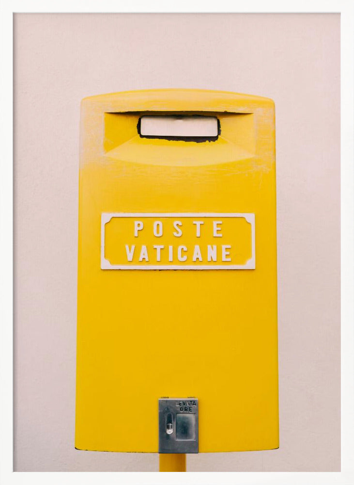 A close-up, front-view photograph of a vibrant yellow Vatican City mailbox against a plain beige wall, enclosed in a thin black frame. The words 'POSTE VATICANE' are printed in white on the front. Artwork