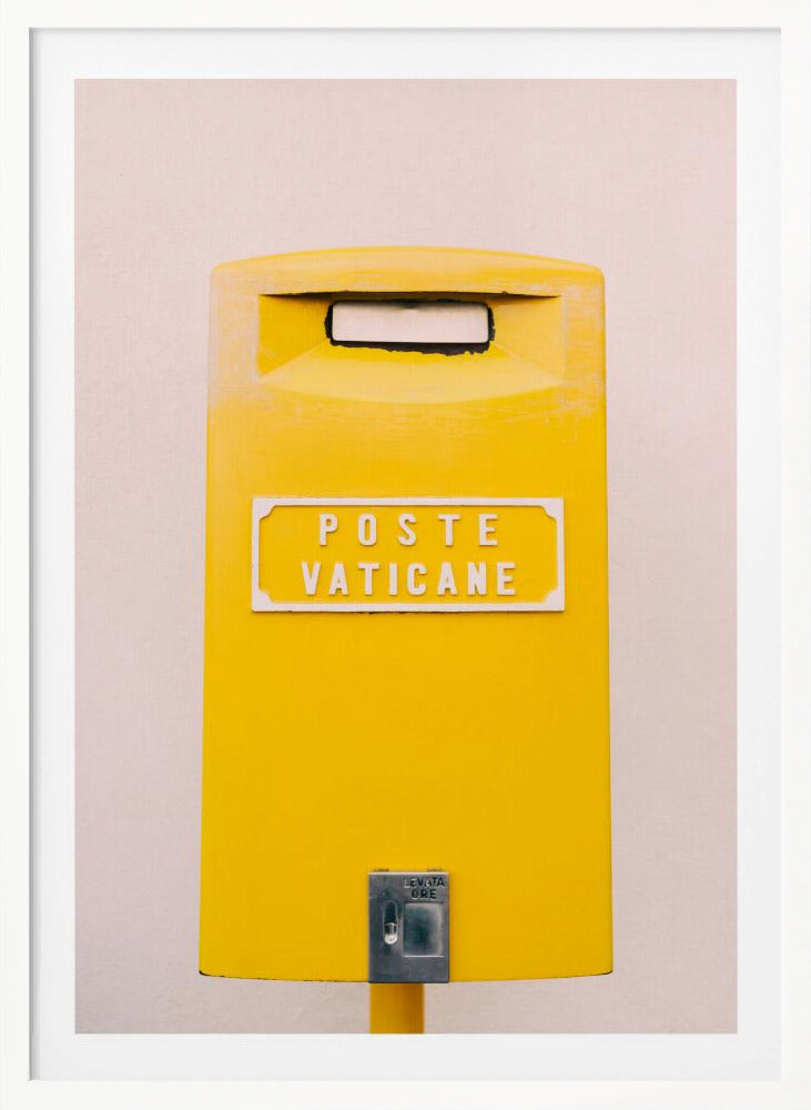 A close-up, front-view photograph of a vibrant yellow Vatican City mailbox against a plain beige wall, enclosed in a thin black frame. The words 'POSTE VATICANE' are printed in white on the front. Artwork