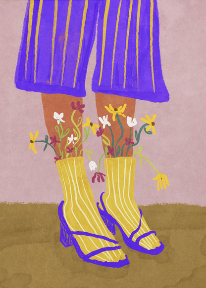 A stylized, colorful illustration focusing on the lower legs and feet of a person wearing vibrant clothing. They have on wide-legged, royal blue trousers with vertical yellow stripes, and yellow socks with white stripes. Small, colorful wildflowers sprout from the tops of their socks. They are wearing bright blue strappy heeled sandals. The background is a soft pink color with a brown floor. Wall Art