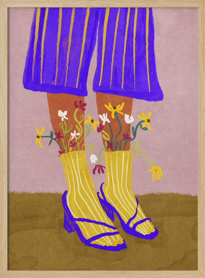 A stylized, colorful illustration focusing on the lower legs and feet of a person wearing vibrant clothing. They have on wide-legged, royal blue trousers with vertical yellow stripes, and yellow socks with white stripes. Small, colorful wildflowers sprout from the tops of their socks. They are wearing bright blue strappy heeled sandals. The background is a soft pink color with a brown floor. Wall Art