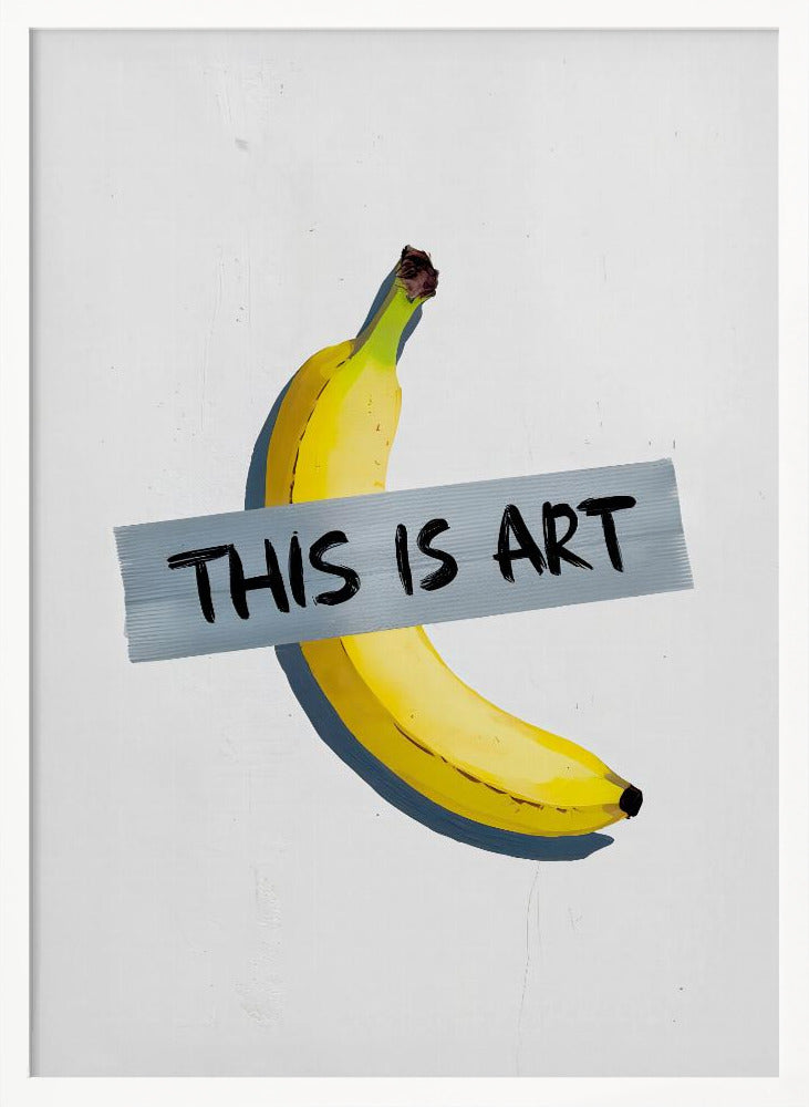 A framed artwork depicting a single yellow banana taped to a white wall with a grey strip of tape that reads 'THIS IS ART' in black marker-style font. Artwork