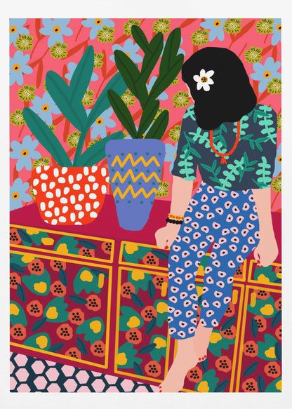 A colorful, maximalist illustration of a woman with black hair and a flower, sitting on a patterned cabinet. She wears a dark blue shirt with green leaves and blue pants with white circles. Next to her are two potted plants in brightly patterned pots, set against a pink and blue floral wallpaper. Poster