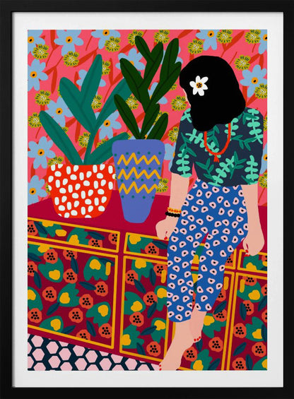 A colorful, maximalist illustration of a woman with black hair and a flower, sitting on a patterned cabinet. She wears a dark blue shirt with green leaves and blue pants with white circles. Next to her are two potted plants in brightly patterned pots, set against a pink and blue floral wallpaper. Poster