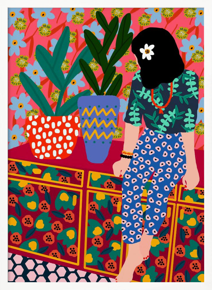 A colorful, maximalist illustration of a woman with black hair and a flower, sitting on a patterned cabinet. She wears a dark blue shirt with green leaves and blue pants with white circles. Next to her are two potted plants in brightly patterned pots, set against a pink and blue floral wallpaper. Poster
