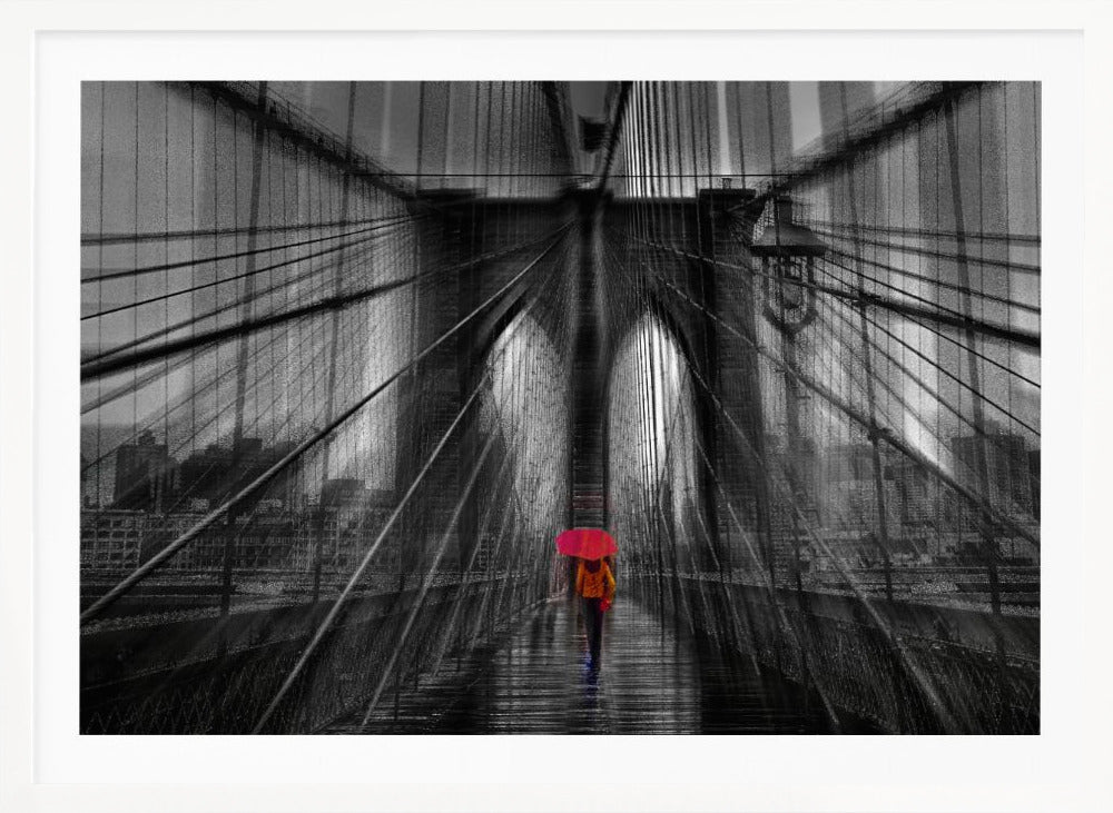 A motion-blurred, black and white photo of the Brooklyn Bridge with a person holding a bright red umbrella walking down the center. The selective color makes the red umbrella the focal point against the dramatic, almost abstract lines of the bridge's cables and arches on a wet, reflective walkway. The image is presented in a silver frame. Wall Art