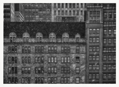 A dense, black and white photograph of various city buildings packed closely together. The image highlights the contrasting architectural styles, from an older stone building with a dark roof in the foreground to taller brick and modern glass buildings in the background, creating a geometric pattern of windows and textures. Decor