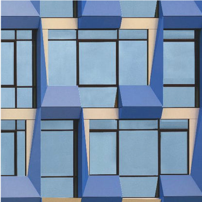 A framed abstract architectural photograph showing a repeating pattern of a modern building's facade. The image features geometric, three-dimensional blue elements surrounding light blue windows with black frames, all set against horizontal cream-colored bands. The entire piece is presented within a light wood frame. Print