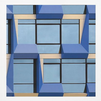 A framed abstract architectural photograph showing a repeating pattern of a modern building's facade. The image features geometric, three-dimensional blue elements surrounding light blue windows with black frames, all set against horizontal cream-colored bands. The entire piece is presented within a light wood frame. Print