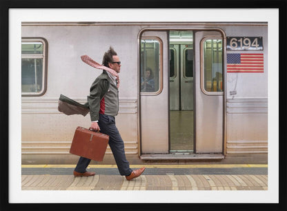 A stylish man with windblown hair and a flying scarf walks briskly along a subway platform, carrying a brown briefcase next to a silver train. Artwork