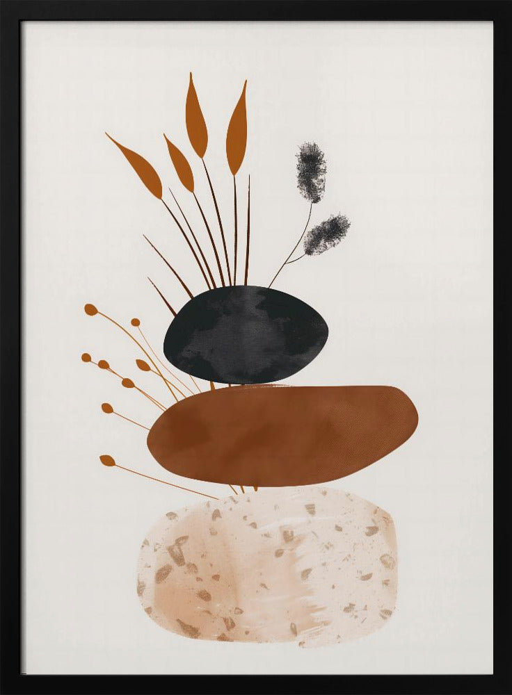A minimalist abstract artwork featuring a stack of three organic, stone-like shapes against an off-white background, framed in black. The bottom shape is a speckled beige, the middle is a solid terracotta brown, and the top is a textured charcoal black. Various stylized botanical elements, including brown reeds and black fuzzy stems, emerge from behind the stack. Decor