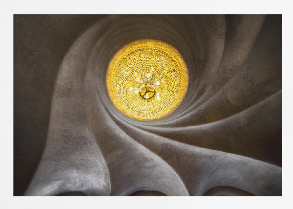 A worm's-eye view of an ornate, golden chandelier set against a swirling, textured dark grey ceiling. The spiraling architectural feature draws the eye to the brightly lit fixture, creating an abstract and dramatic composition. Poster