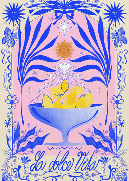 A vibrant, symmetrical illustration featuring a blue bowl of yellow lemons set against a pink arched background. The scene is framed by elaborate blue botanicals, flowers, butterflies, and celestial symbols like suns with faces. At the bottom, the phrase 'La dolce Vita' is written in elegant blue script. Decor