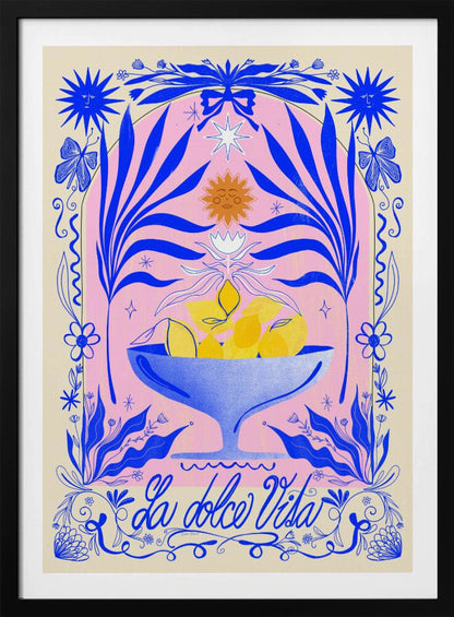 A vibrant, symmetrical illustration featuring a blue bowl of yellow lemons set against a pink arched background. The scene is framed by elaborate blue botanicals, flowers, butterflies, and celestial symbols like suns with faces. At the bottom, the phrase 'La dolce Vita' is written in elegant blue script. Decor