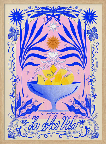 A vibrant, symmetrical illustration featuring a blue bowl of yellow lemons set against a pink arched background. The scene is framed by elaborate blue botanicals, flowers, butterflies, and celestial symbols like suns with faces. At the bottom, the phrase 'La dolce Vita' is written in elegant blue script. Decor