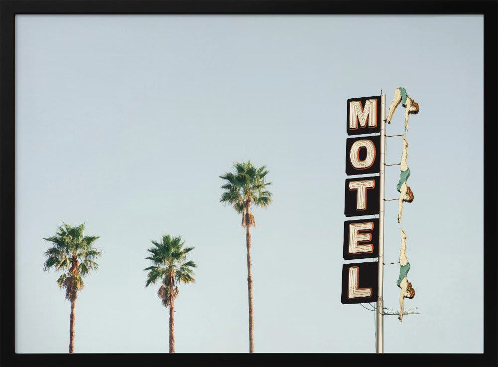 A minimalist photograph featuring three tall palm trees and a vertical black and white 'MOTEL' sign against a pale blue sky. Affixed to the sign's pole are several figures of women in green swimsuits, posed as if diving in a synchronized formation. Poster