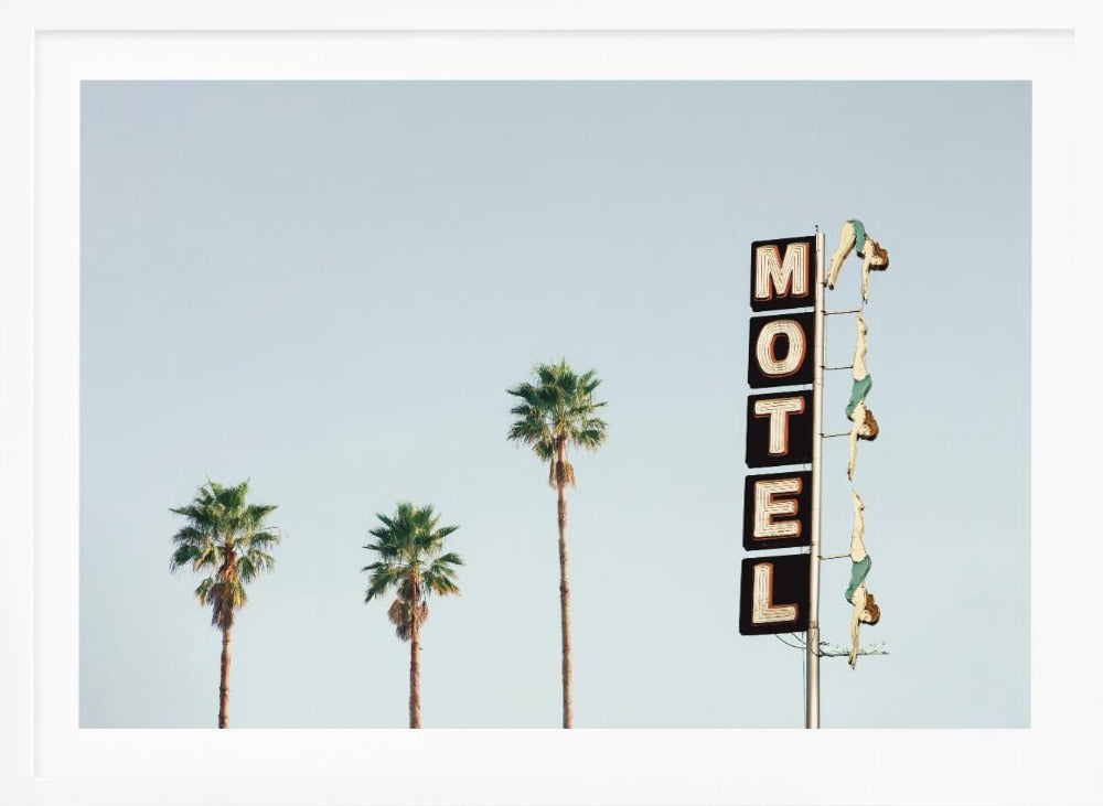 A minimalist photograph featuring three tall palm trees and a vertical black and white 'MOTEL' sign against a pale blue sky. Affixed to the sign's pole are several figures of women in green swimsuits, posed as if diving in a synchronized formation. Poster
