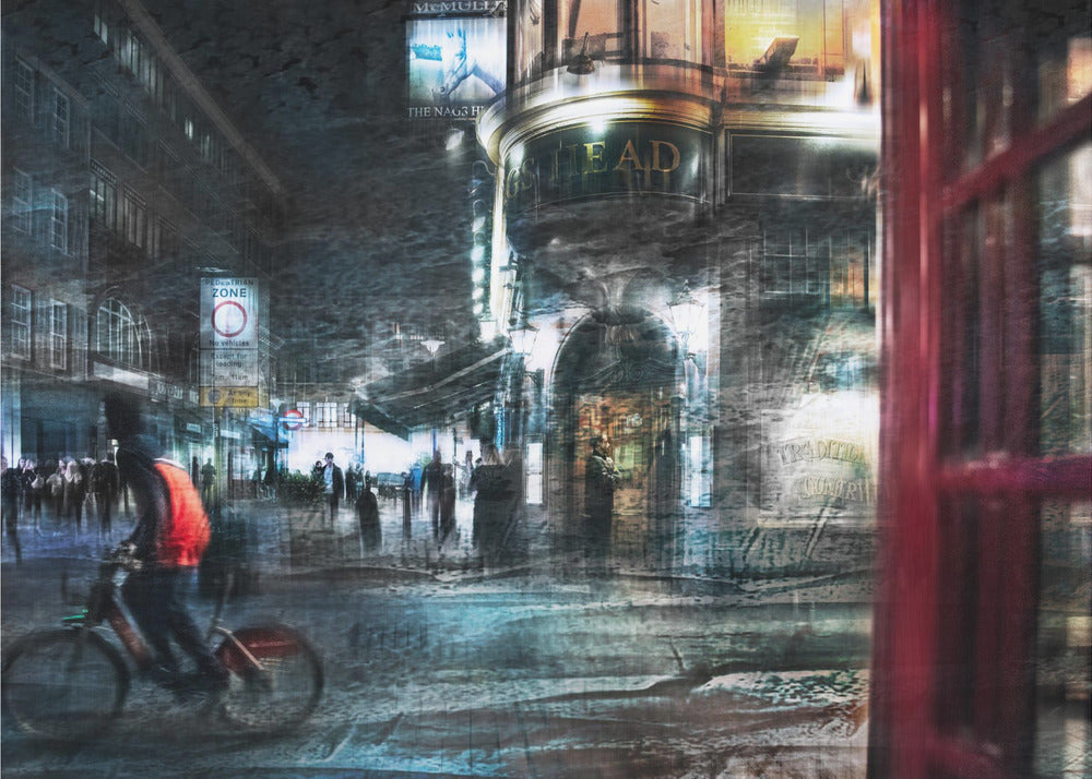 An abstract, moody digital artwork of a bustling London street at night. The scene has a layered, textured look with motion blur, featuring a cyclist in a red vest, the illuminated sign for 'The Nag's Head' pub, and a classic red telephone booth in the foreground, all within a silver frame. Wall Art