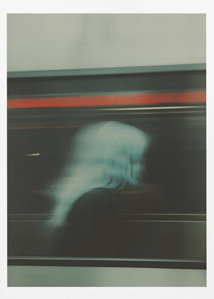 An abstract photograph with motion blur, featuring the ghostly silhouette of a person's head and shoulders in pale blue. The dark background is streaked with horizontal lines of red and white light, suggesting the speed of a passing train or subway. Wall Art