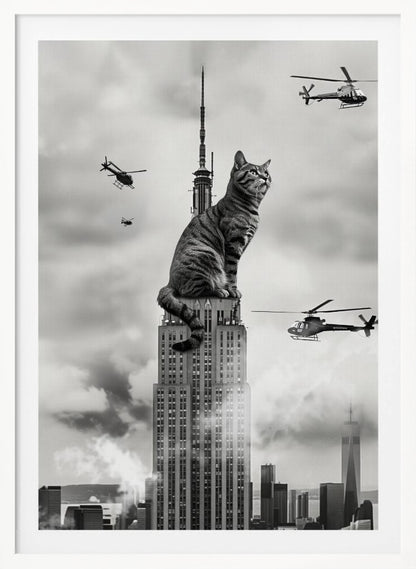 A surreal black and white image depicting a giant tabby cat sitting on top of the Empire State Building, similar to King Kong. Helicopters fly around the colossal cat against a cloudy New York City skyline. Decor