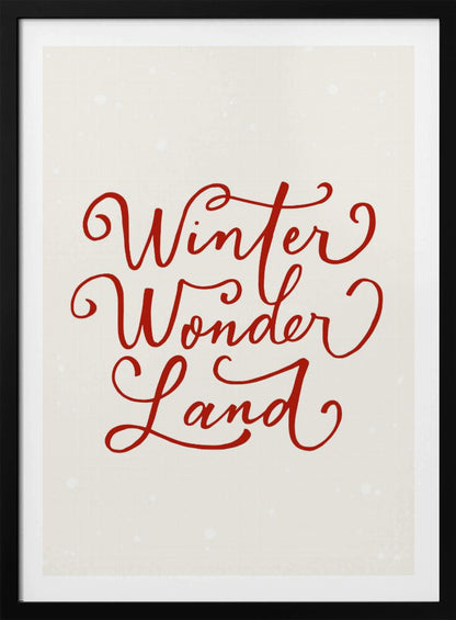 A holiday-themed art print with the words 'Winter Wonder Land' written in a flowing red script font on a speckled, off-white background, all enclosed within a simple black frame. Artwork