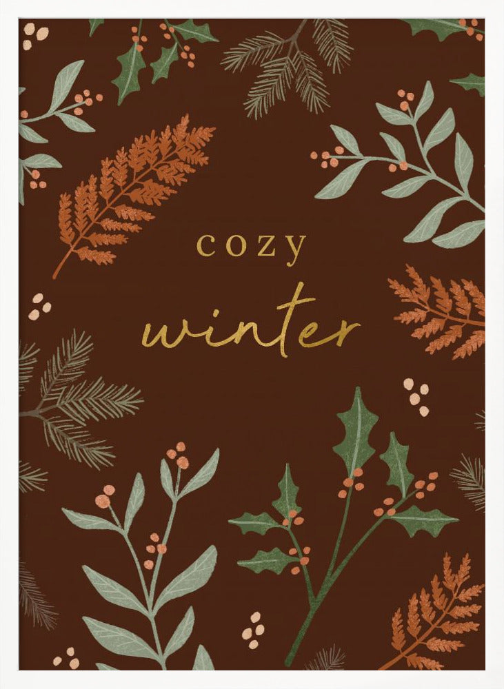 A warm, illustrative poster with a dark brown background featuring the words 'cozy winter' in gold script at the center. The text is framed by a wreath of winter botanicals, including holly, pine needles, and ferns in shades of green and burnt orange. Print
