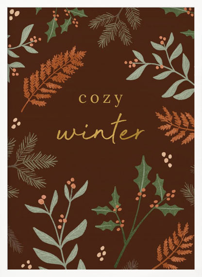 A warm, illustrative poster with a dark brown background featuring the words 'cozy winter' in gold script at the center. The text is framed by a wreath of winter botanicals, including holly, pine needles, and ferns in shades of green and burnt orange. Print