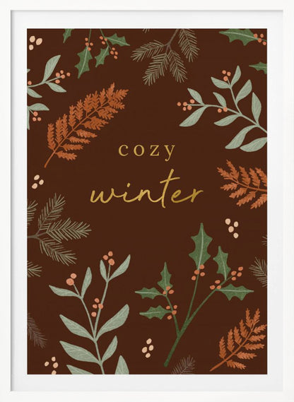 A warm, illustrative poster with a dark brown background featuring the words 'cozy winter' in gold script at the center. The text is framed by a wreath of winter botanicals, including holly, pine needles, and ferns in shades of green and burnt orange. Print