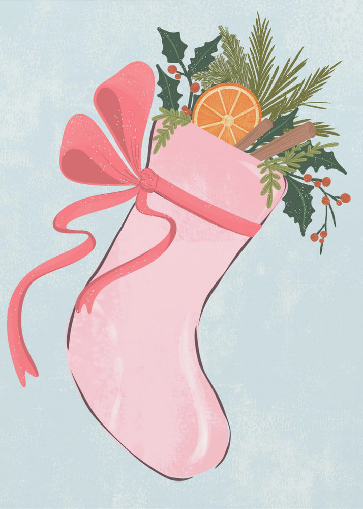 A festive illustration of a pink Christmas stocking against a light blue textured background. The stocking is tied with a large pink ribbon and is filled with holiday greenery, including holly with red berries, pine needles, a slice of dried orange, and cinnamon sticks. Decor