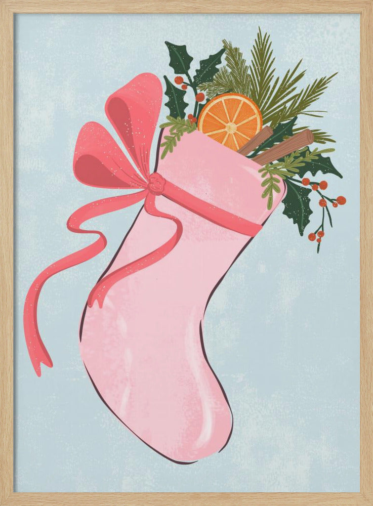 A festive illustration of a pink Christmas stocking against a light blue textured background. The stocking is tied with a large pink ribbon and is filled with holiday greenery, including holly with red berries, pine needles, a slice of dried orange, and cinnamon sticks. Decor