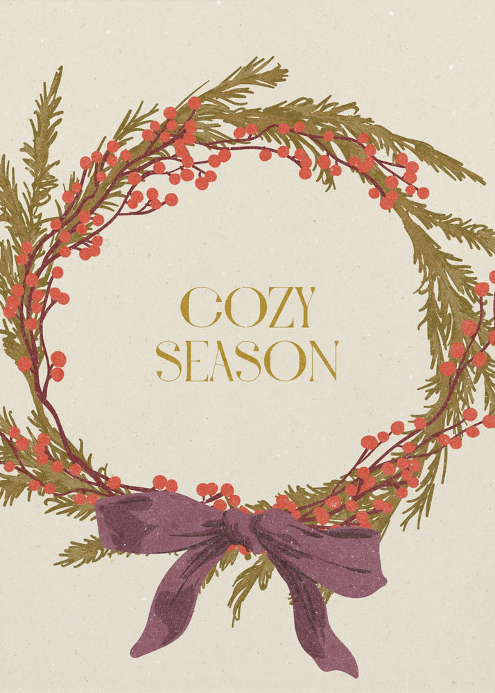 A vintage-style illustration of a festive wreath made of green boughs and red berries, tied with a large purple bow at the bottom. The text 'COZY SEASON' is written in gold inside the wreath on a cream-colored background, all enclosed in a thin black frame. Wall Art