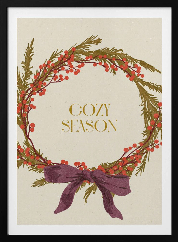 A vintage-style illustration of a festive wreath made of green boughs and red berries, tied with a large purple bow at the bottom. The text 'COZY SEASON' is written in gold inside the wreath on a cream-colored background, all enclosed in a thin black frame. Wall Art