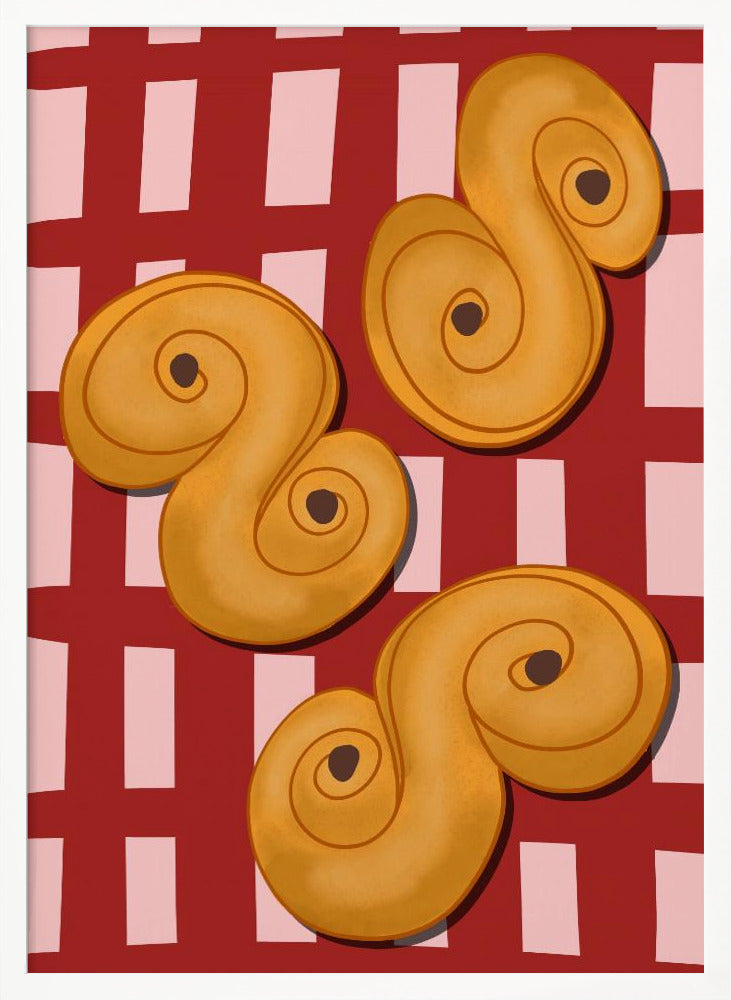 A vibrant illustration of three golden-yellow S-shaped pastries, resembling Swedish saffron buns, resting on a red and pink checkered tablecloth. The artwork is presented within a black frame. Decor