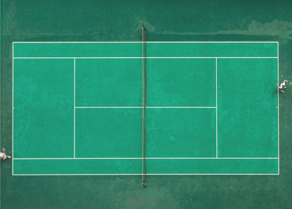 An aerial top-down photograph of a vibrant green tennis court with two players in the middle of a game, one on the far left and the other on the far right, all enclosed within a brushed silver frame. Print