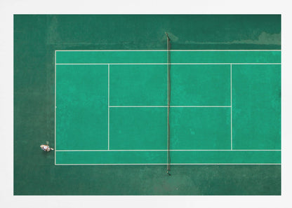 An aerial top-down photograph of a vibrant green tennis court with two players in the middle of a game, one on the far left and the other on the far right, all enclosed within a brushed silver frame. Print