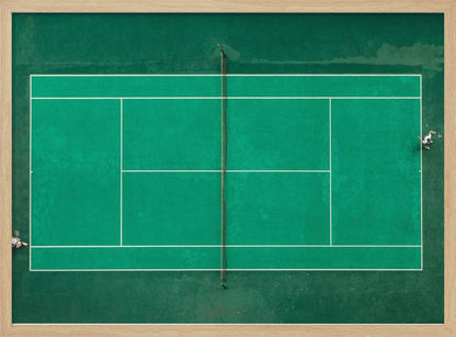 An aerial top-down photograph of a vibrant green tennis court with two players in the middle of a game, one on the far left and the other on the far right, all enclosed within a brushed silver frame. Print