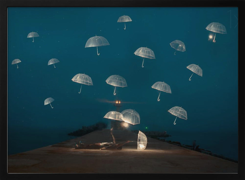 A surreal night scene with a person lying on a pier next to a glowing, transparent umbrella, while numerous other glowing umbrellas float like jellyfish in the dark blue sky above the sea, with a distant lighthouse in the background. Poster