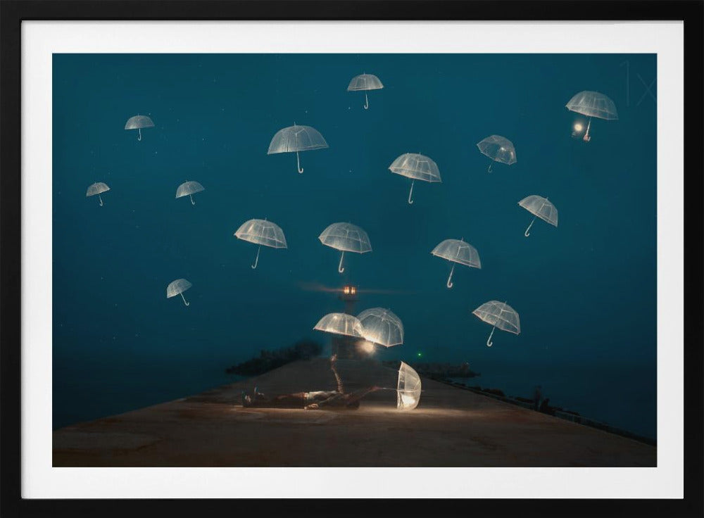A surreal night scene with a person lying on a pier next to a glowing, transparent umbrella, while numerous other glowing umbrellas float like jellyfish in the dark blue sky above the sea, with a distant lighthouse in the background. Poster