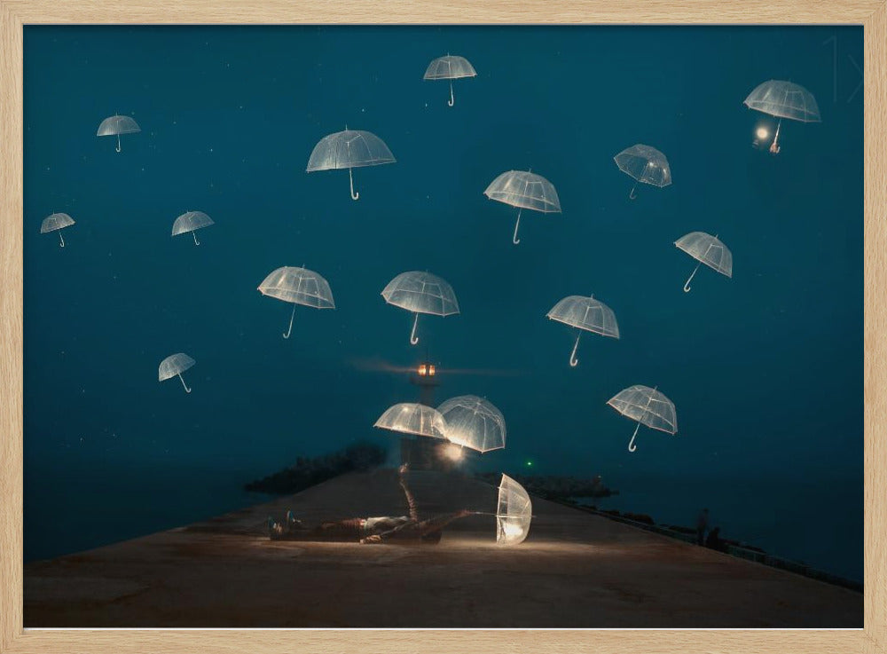 A surreal night scene with a person lying on a pier next to a glowing, transparent umbrella, while numerous other glowing umbrellas float like jellyfish in the dark blue sky above the sea, with a distant lighthouse in the background. Poster