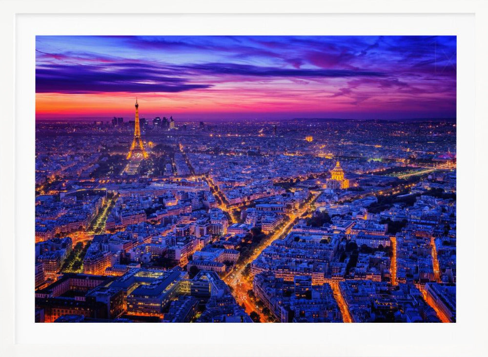 An aerial panoramic view of Paris at dusk, with the cityscape illuminated in cool blue and warm yellow lights. The Eiffel Tower is prominently lit on the left under a dramatic sunset sky transitioning from orange and pink to deep purple. Poster