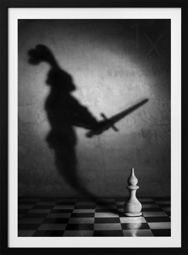 A black and white conceptual photograph of a single white chess piece on a checkerboard, casting a large, ominous shadow of a medieval knight holding a sword against a textured wall. Print