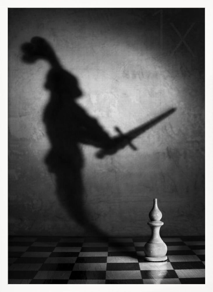 A black and white conceptual photograph of a single white chess piece on a checkerboard, casting a large, ominous shadow of a medieval knight holding a sword against a textured wall. Print