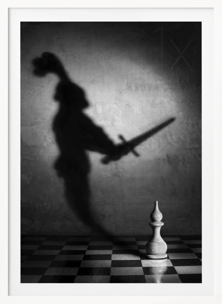 A black and white conceptual photograph of a single white chess piece on a checkerboard, casting a large, ominous shadow of a medieval knight holding a sword against a textured wall. Print