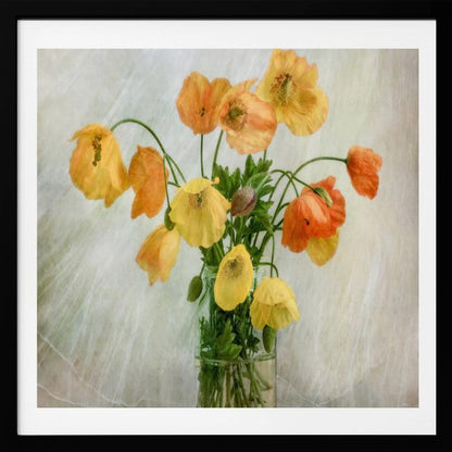 A soft-focus still life photograph of a bouquet of yellow and orange poppies in a clear glass jar, set against a delicate, light green textured background, all enclosed in a light wood frame. Print
