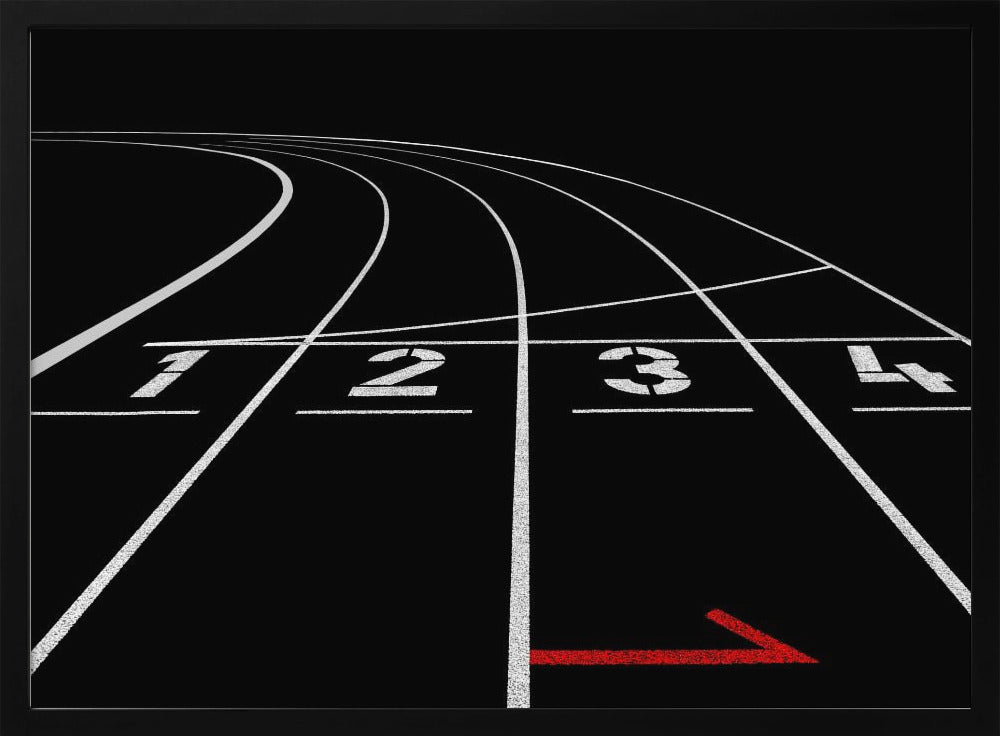 A framed, high-contrast photograph of a black running track's starting line. The lanes, marked with white lines, are numbered 1, 2, 3, and 4 and curve into the distance. A single red arrow points forward in the foreground, adding a pop of color to the monochrome scene. Poster